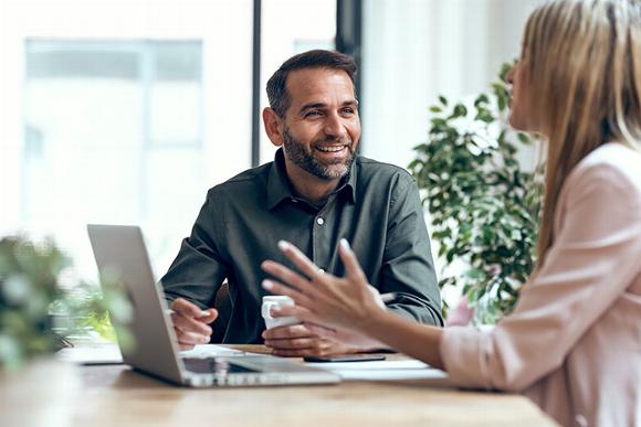 man and woman in meeting