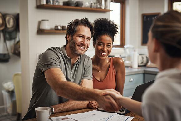 couple talking with mortgage adviser