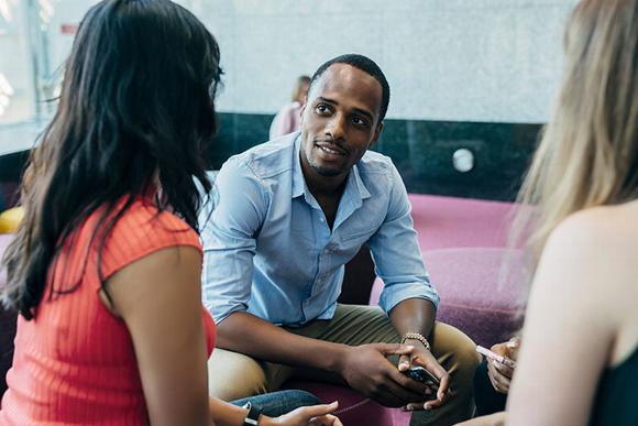 advisors talking in lobby of building